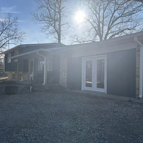Home with new gutters on a sunny day
