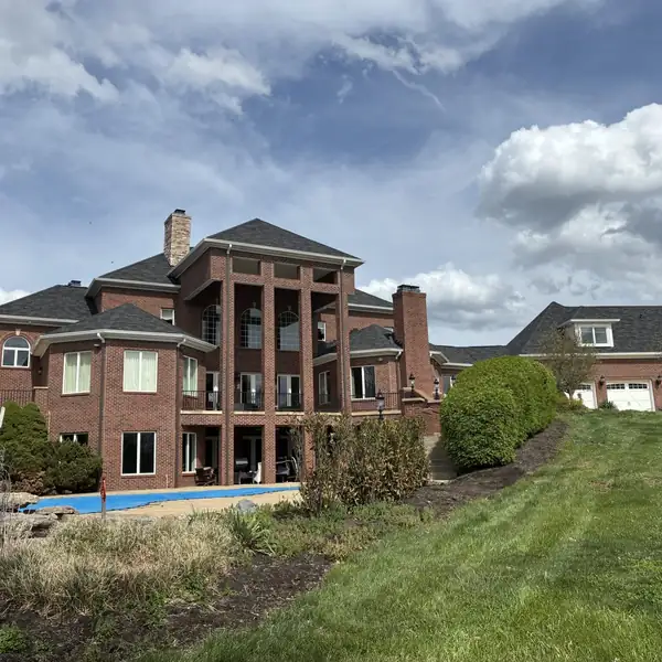 Brick home with seamless gutters by Premier Gutters