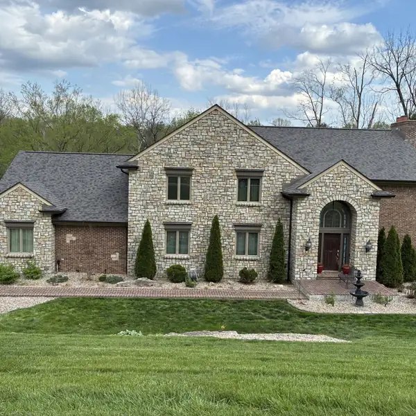 Stone home with new gutters in Southern Indiana